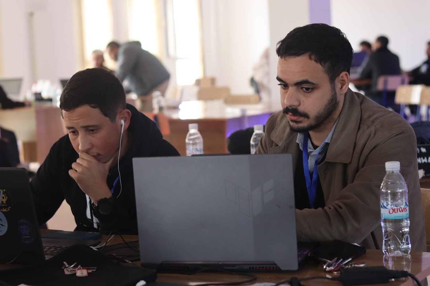 Ali MEHIZEL working on a laptop